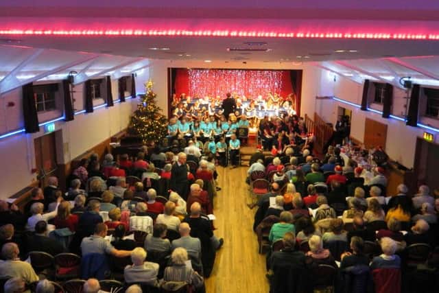 Sussex West County Guide Choir, the Friendship Singers and Littlehampton Concert Band on stage