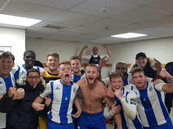 Haywards Heath Town players celebrate after beating Crawley Town. Picture by Roy Staughton