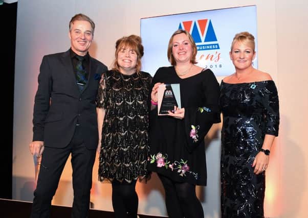 Suzanne Ryan (centre left) and Emma Connor (centre right) accept their award