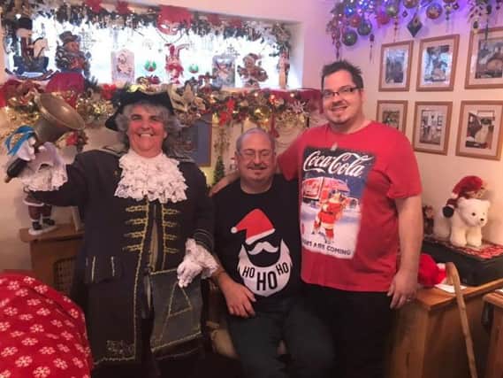 Angela Standing with Chris Blanchard-Cooper and Billy Blanchard-Cooper in their home in Thames Close, Littlehampton, which the couple have turned into a festive wonderland