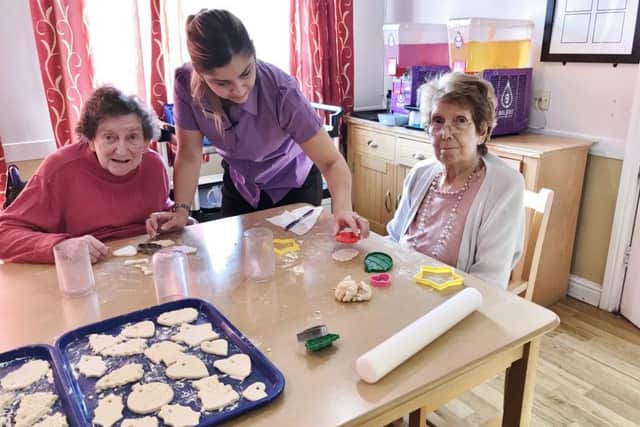 Residents and team members at Darlington Court baking biscuits ahead of the Community Christmas event