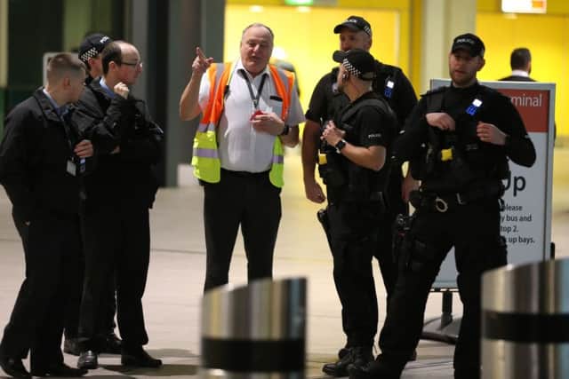 Armed police on scene at Gatwick Airport last night, photo by Eddie Mitchell SUS-181221-070756001