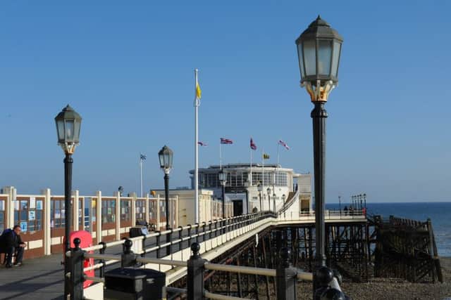 Worthing Pier was built in 1862, wrecked in a violent storm in 1913 and all but burnt down in 1933, then cut in half in 1940, but still stands proud. Picture: Derek Martin D14161606a