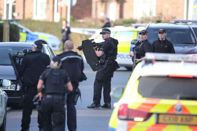 Armed police on scene, photo by Eddie Mitchell