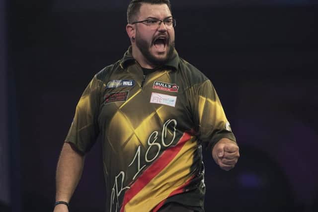 Cristo Reyes stands between Rob Cross and a place in the last 16 of the William Hill World Darts Championship. Picture courtesy Lawrence Lustig/PDC