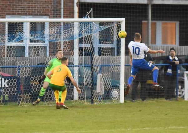 Karly Akehurst heads home the first goal. Haywards Heath Town v Horsham. Picture by Grahame Lehkyj SUS-181223-185020001