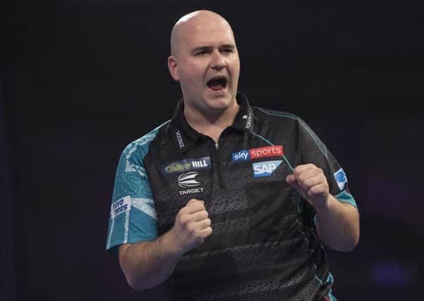 Rob Cross celebrates during his victory over Cristo Reyes. Picture courtesy Lawrence Lustig/PDC