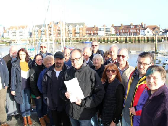 Littlehampton boat owners are protesting against what they see as unaffordable charges set by Littlehampton Harbour Board. Arun Yacht Club Commodore Phil Turnbull, holding letter, with a copy of the objection letters sent by Arun boat owners to the Department of Transport