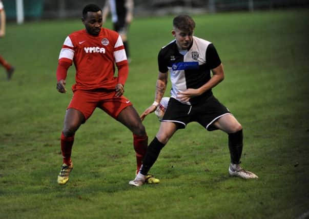Horsham YMCA forward Tony Nwachukwu netted twice against East Preston. Picture by Stephen Goodger