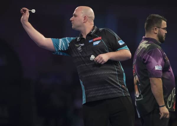 Rob Cross at the oche during his third round victory over Cristo Reyes last night. Picture courtesy Lawrence Lustig/PDC