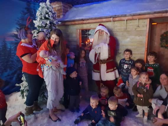 Munchkins Parent, Baby & Toddler group enjoy a meeting with Father Christmas