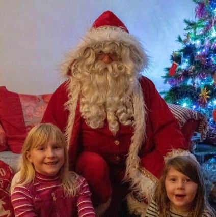 Megan, eight, and Michaela, four, had a special visit from Santa Claus.