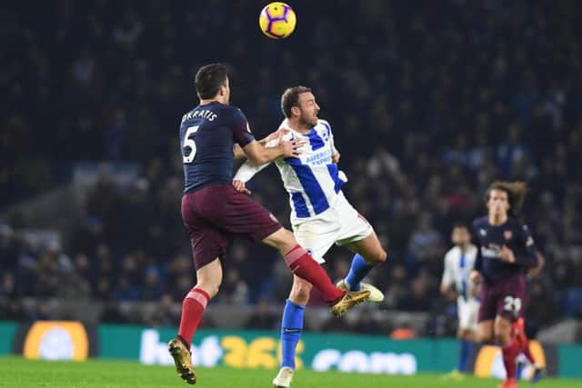 Glenn Murray challenges Sokratis. Picture by PW Sporting Photography