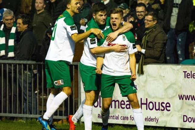 Joe Tomlinson celebrates his first Bognor goal - the equaliser - with Jimmy Muitt and Brad Lethbridge / Picture by Tommy McMillan