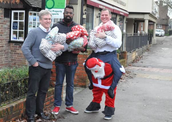 Pictured left to right MP Henry Smith, Romesh Ranganathan and Darren Greenaway.