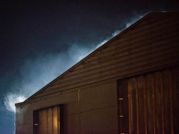 Smoke was seen billowing from the former Dreams bed store building