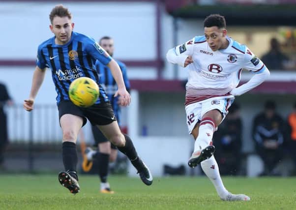 Antonio Walker plays a pass during Hastings United's 1-0 win at home to Sevenoaks Town on Boxing Day. Picture courtesy Scott White