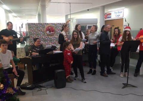 Students from the Sir Robert Woodard Academy provide musical entertainment