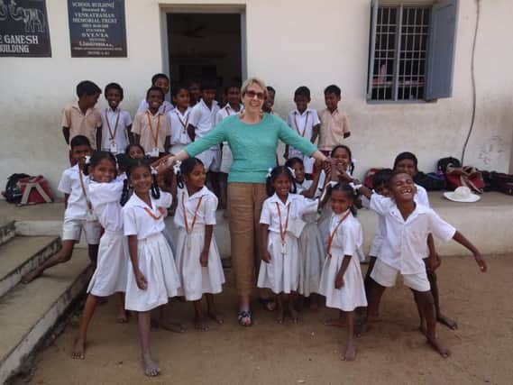 Sylvia Holder with children in Kovalam, India