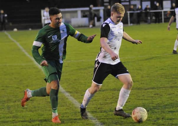 Liam Foster on the ball during Bexhill United's 2-1 win at home to Mile Oak this afternoon. Pictures by Simon Newstead