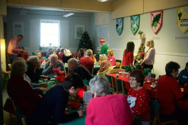 Guests enjoy Christmas Day lunch at Oakwood School