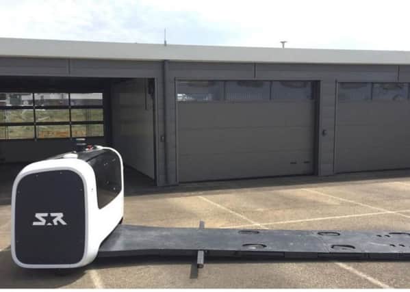 An image of the parking robot and typical cabin (based on a similar operation at Lyon airport). From Crawley Borough Council's planning portal