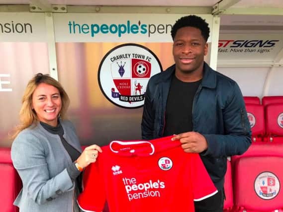Ricky is pictured with Operations Director Kelly Derham after completing his signing. Picture courtesy of Crawley Town