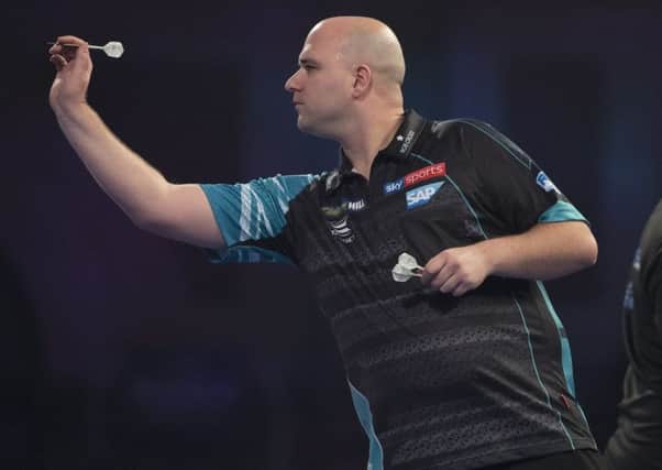 Rob Cross at the oche during his last 16 defeat to Luke Humphries at the William Hill World Darts Championship on Friday night. Picture courtesy Lawrence Lustig/PDC
