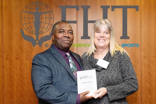 Alison Brown receives her 2018 FHT Local Support Group Co-ordinator or the Year award from vice president Herman Fenton for sharing the content of her group meetings via a number of online platforms for therapists unable to attend in person