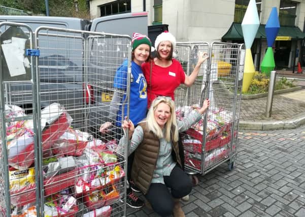 Louise Bartha, Lucy Pond and Caroline Davenport Potter delivering Christmas hampers to the Royal Alexandra Hospital in Brighton SUS-190901-165400001