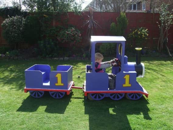 Thomas the Tank Engine being driven by grandson Sam when he was younger