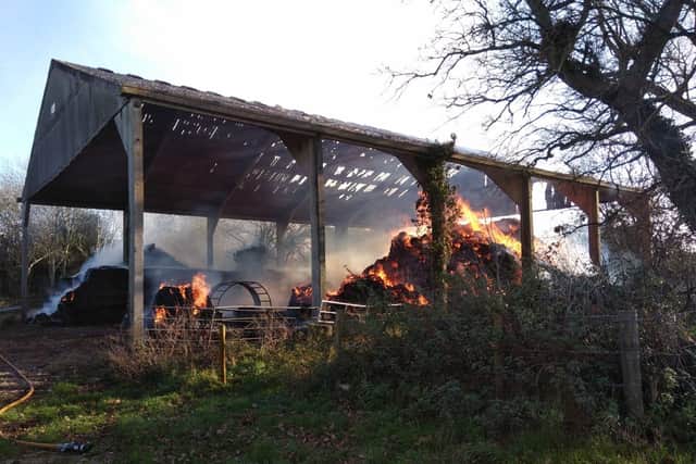 More than 60 tonnes of hay are said to be alight