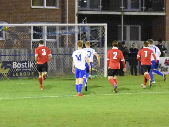 Callum Saunders' penalty hits the roof of the net.