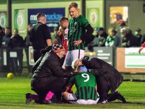 Ben Pope receives treatment on Saturday. Picture by Chris Neal