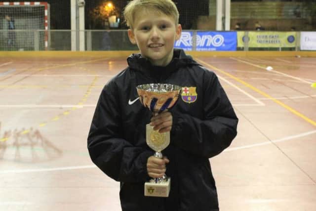 Ethan Stapley with his first trophy as a Barcelona Academy player