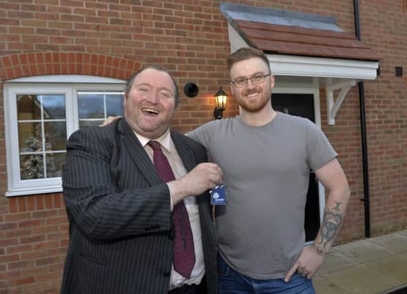 Darren Williams, pictured with Councillor Michael Jones, moved into his Crawley home with his new daughter and partner.