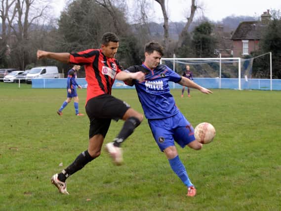 Liam Dreckmann challenges for Midhurst in their clash with Oakwood / Picture by Kate Shemilt