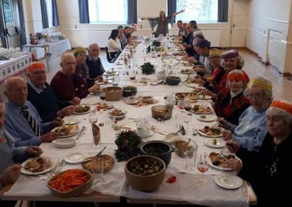 Diners enjoying lunch on Christmas Day 2018 at Burwash village hall SUS-190801-120354001