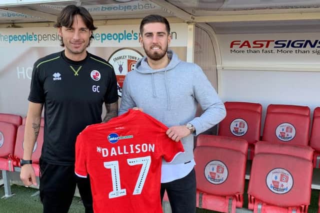 Crawley Town head coach Gabriele Cioffi welcomes new signing Tom Dallison.
Picture courtesy of Crawley Town