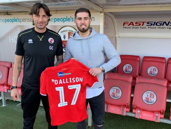 Crawley Town head coach Gabriele Cioffi welcomes new signing Tom Dallison.
Picture courtesy of Crawley Town