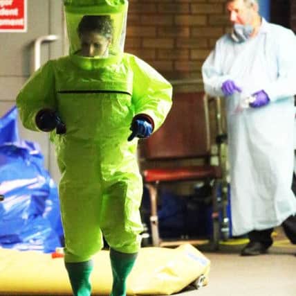 Staff at Eastbourne DGH set up a tent and wore hazmat suits to deal with the unprecendented chemical incident