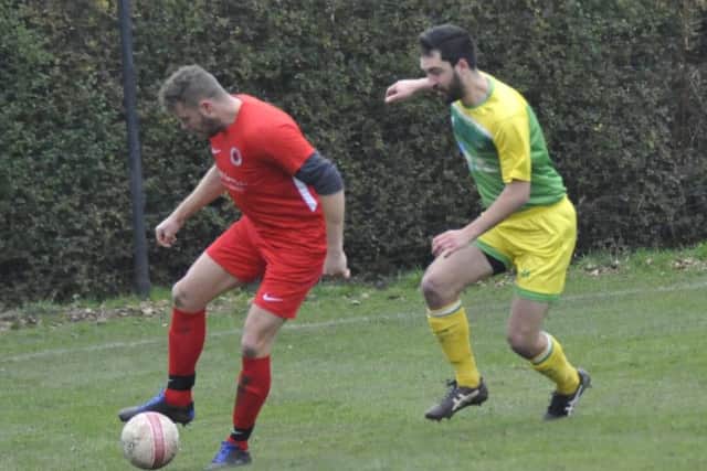 Westfield defender Fabio Histed keeps a close eye on a Littlehampton United opponent