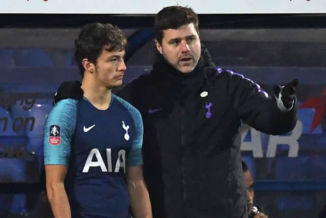 George Marsh receives instructions from Tottenham Hotspur head coach Mauricio Pochettino as he prepares to come on as a substitute against Tranmere Rovers. Picture courtesy Paul Ellis/AFP/Getty Images