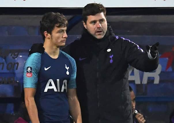 George Marsh receives instructions from Tottenham Hotspur head coach Mauricio Pochettino as he prepares to come on as a substitute against Tranmere Rovers. Picture courtesy Paul Ellis/AFP/Getty Images