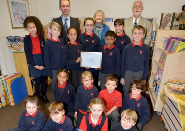 Seaview presents award to Sacred Heart Catholic Primary School.  Pupils pictured with L-R back row: Head teacher Joseph Hellett, Sheila and Rick Bevis. SUS-190901-131506001