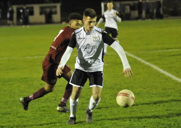 Jamie Bunn on the ball during Bexhill United's 1-0 defeat at home to Alfold. Picture by Simon Newstead