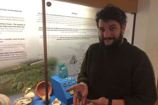 Archaeological curator James Sainsbury with the Venus statuette