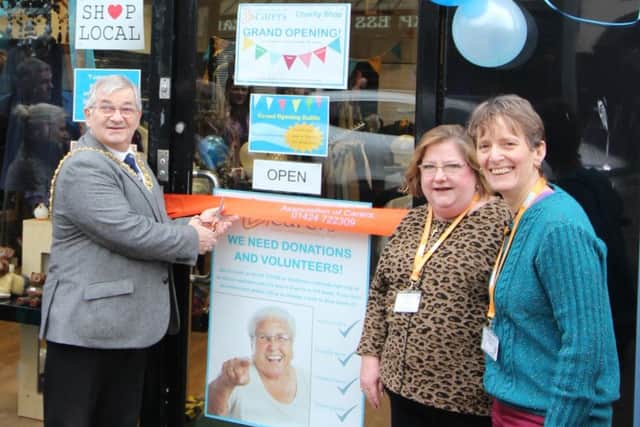 Hastings Mayor Cllr Nigel Sinden, Susan Augustus and Sue Palmer (charity director) at the official opening of The Association of Carers charity shop, Queens Road, Hastings SUS-190115-101811001