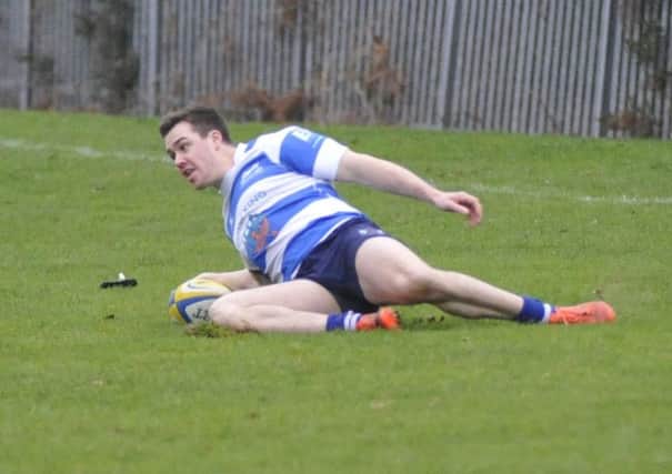 Tim Sills touches down to score a try for Hastings & Bexhill against Old Williamsonians. Pictures by Simon Newstead