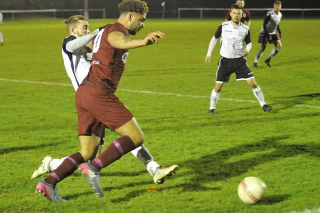 Bexhill United full-back Nathan Lopez makes a tackle against Alfold